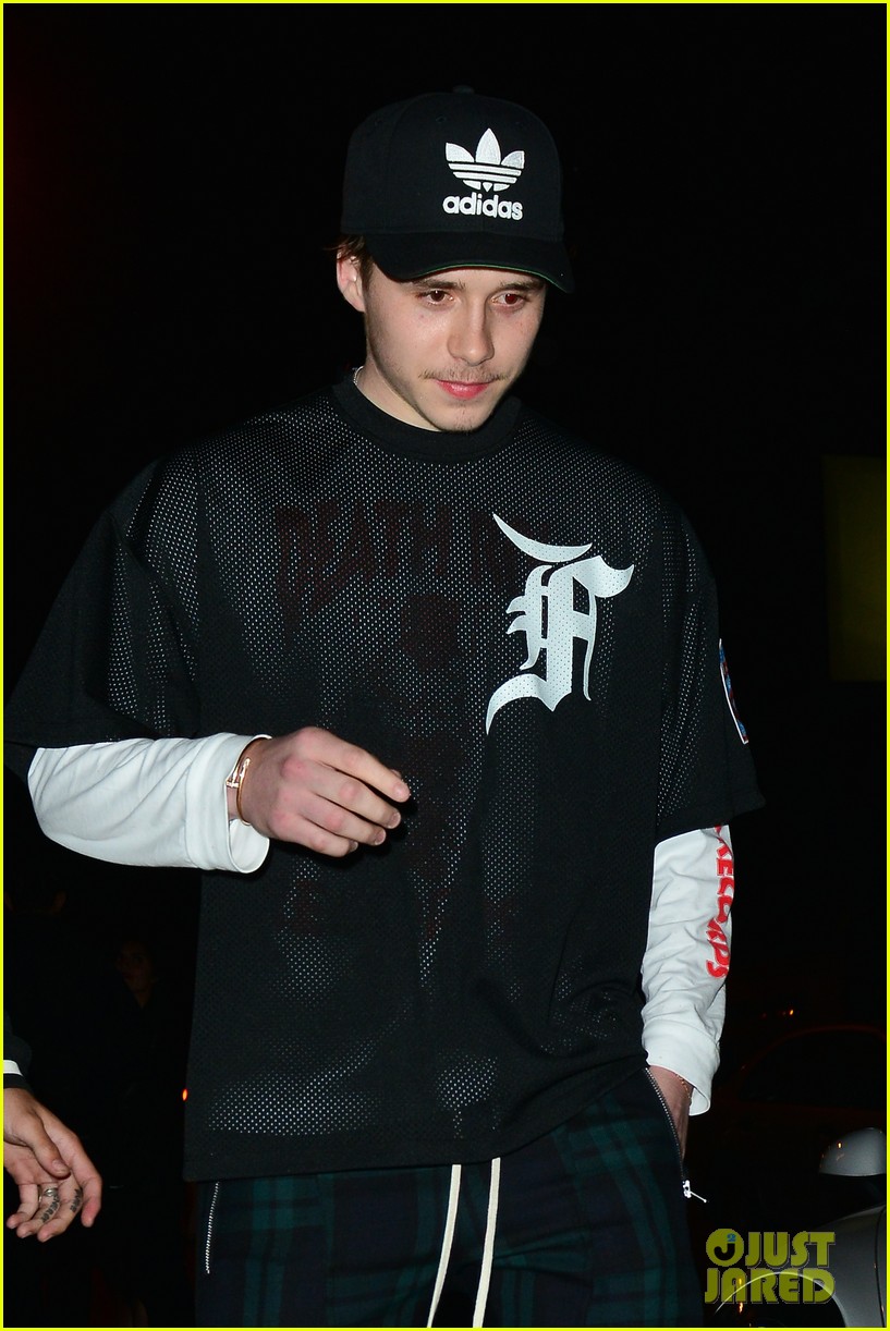 brooklyn beckham covers up his new tattoo during night out with friend 11