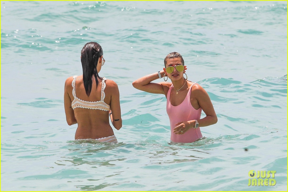 hailey baldwin enjoys miami beach in her pink swimsuit 12