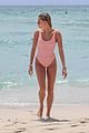 hailey baldwin enjoys miami beach in her pink swimsuit 01