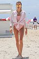 hailey baldwin enjoys miami beach in her pink swimsuit 03