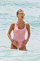 hailey baldwin enjoys miami beach in her pink swimsuit 04