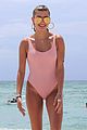 hailey baldwin enjoys miami beach in her pink swimsuit 06