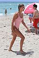 hailey baldwin enjoys miami beach in her pink swimsuit 17