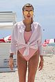 hailey baldwin enjoys miami beach in her pink swimsuit 20