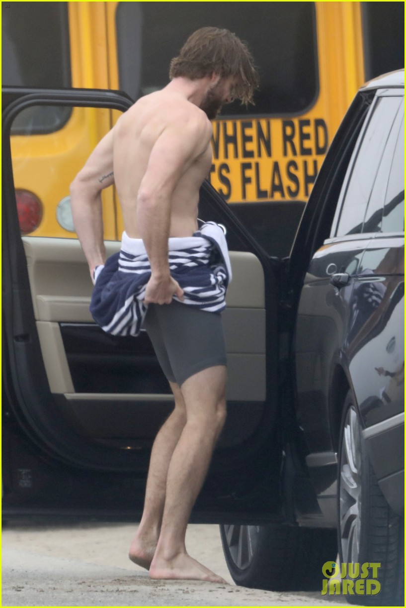 liam hemsworth strips out of wetsuit to reveal ripped abs 05