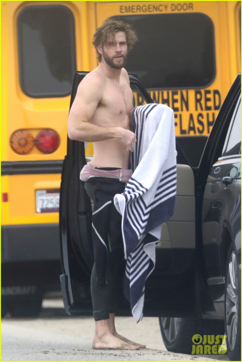 liam hemsworth strips out of wetsuit to reveal ripped abs 24