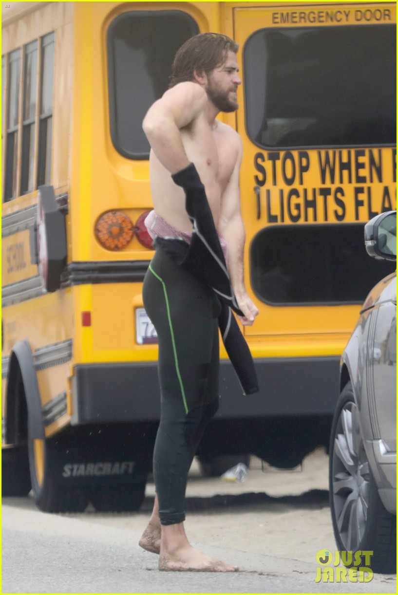 liam hemsworth strips out of wetsuit to reveal ripped abs 25