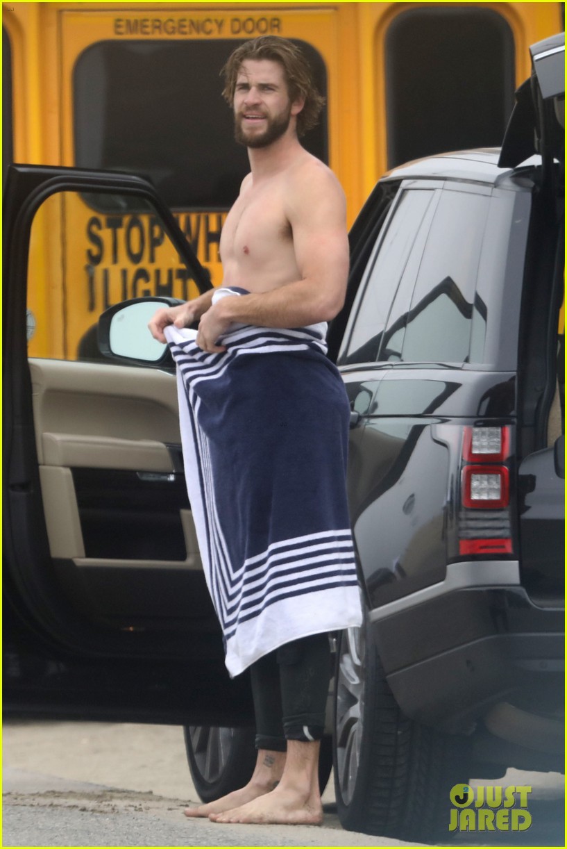 liam hemsworth strips out of wetsuit to reveal ripped abs 55
