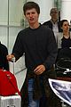 ansel elgort gets greeted by fans at australia airport 06