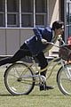 cole sprouse rides bike riverdale set 05