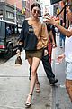 kendall jenner shows off her legs in olive green skirt and oversized sweatshirt 03