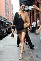 kendall jenner shows off her legs in olive green skirt and oversized sweatshirt 04