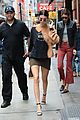 kendall jenner shows off her legs in olive green skirt and oversized sweatshirt 05