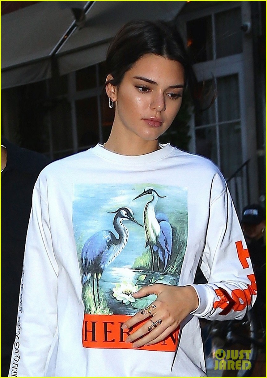 kendall jenner brightens up outfit with orange bag 01