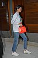 kendall jenner brightens up outfit with orange bag 02