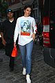 kendall jenner brightens up outfit with orange bag 05
