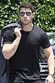nick jonas shows off his buff biceps in a tight t shirt 03