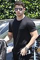 nick jonas shows off his buff biceps in a tight t shirt 05