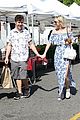 nolan gould hannah glasby hold hands famers market 01