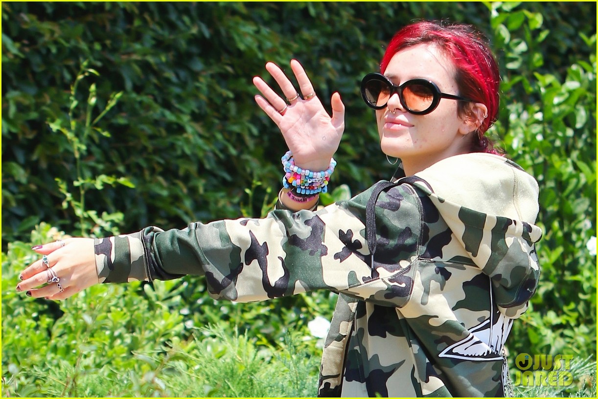 bella thorne leaves little to the imagination in plunging 26