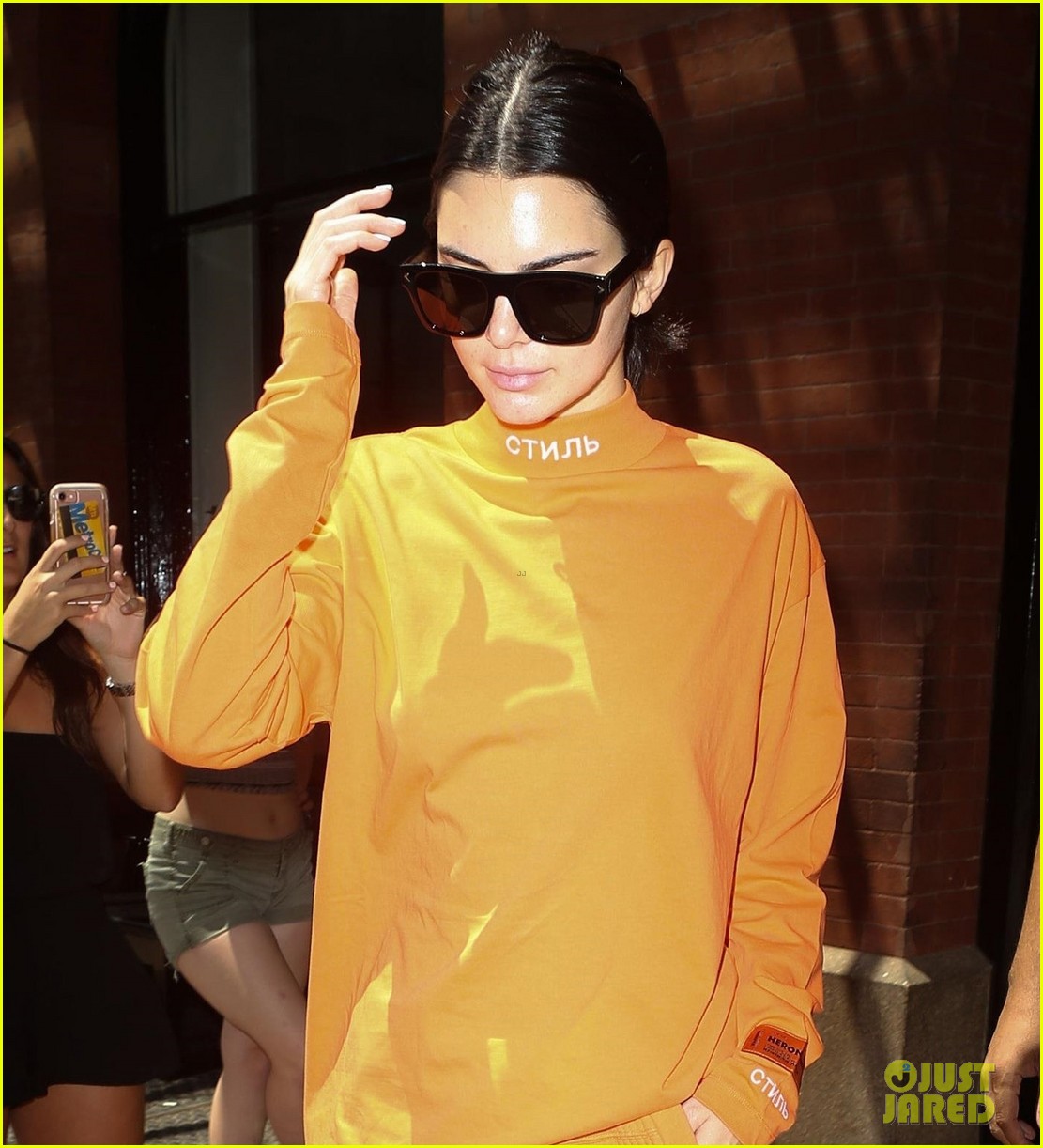kendall jenner wears all orange for her flight out of new york 02