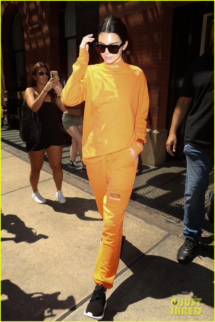 kendall jenner wears all orange for her flight out of new york 07