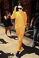 kendall jenner wears all orange for her flight out of new york 07