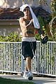 justin bieber goes shirtless and flashes his abs during walk around la 02