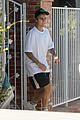 justin bieber goes shirtless and flashes his abs during walk around la 08