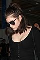 lorde keeps her head low for her flight out of town 02