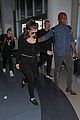 lorde keeps her head low for her flight out of town 03
