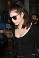 lorde keeps her head low for her flight out of town 06
