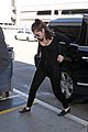 lorde keeps her head low for her flight out of town 09