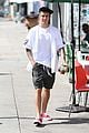 justin bieber walks by wings wall portrait at perfect time 01