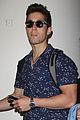 brandon larracuente shows off bulging biceps at airport with girlfriend 05