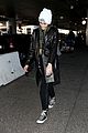 kaia gerber arrives in la in a new york beanie following paris fashion week 03