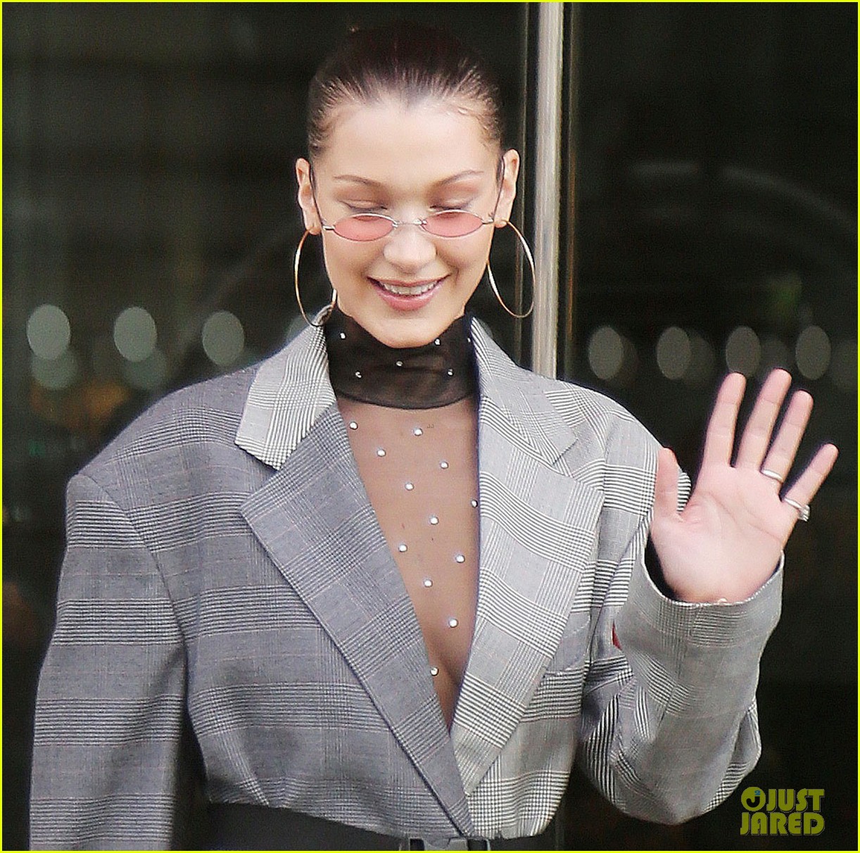 bella hadid goes bralass in a sheer top and two tone suit jacket 03