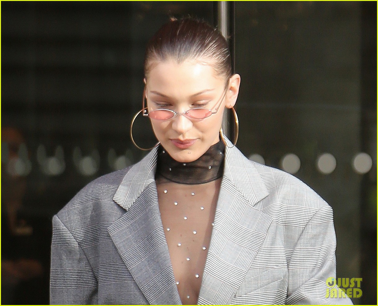 bella hadid goes bralass in a sheer top and two tone suit jacket 05