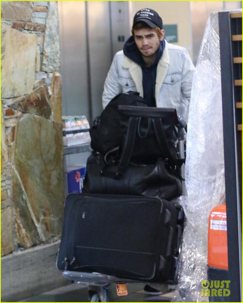 kj apa arrives in vancouver with mystery blonde 10