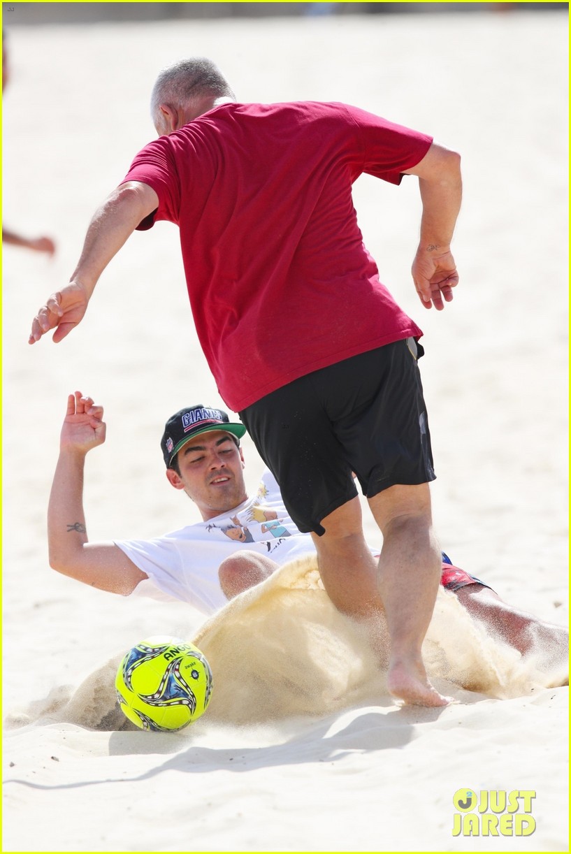 joe jonas plays soccer on the beach in sydney 06