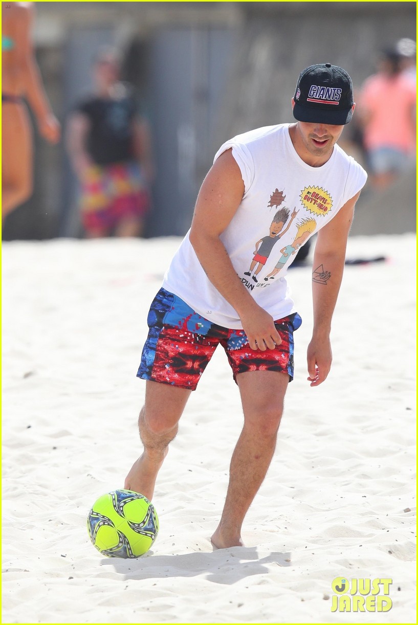 joe jonas plays soccer on the beach in sydney 08