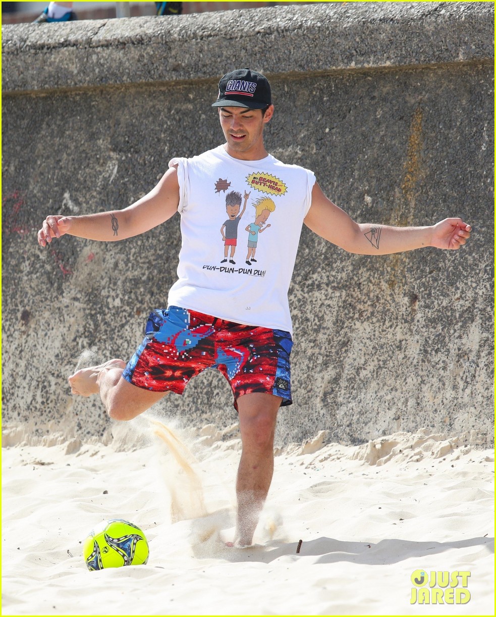 joe jonas plays soccer on the beach in sydney 39