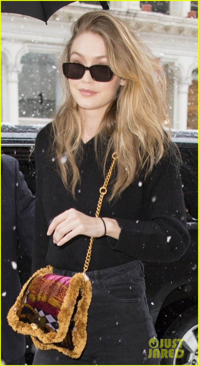 gigi hadid rocks colorful purse and boots while braving the snow 04