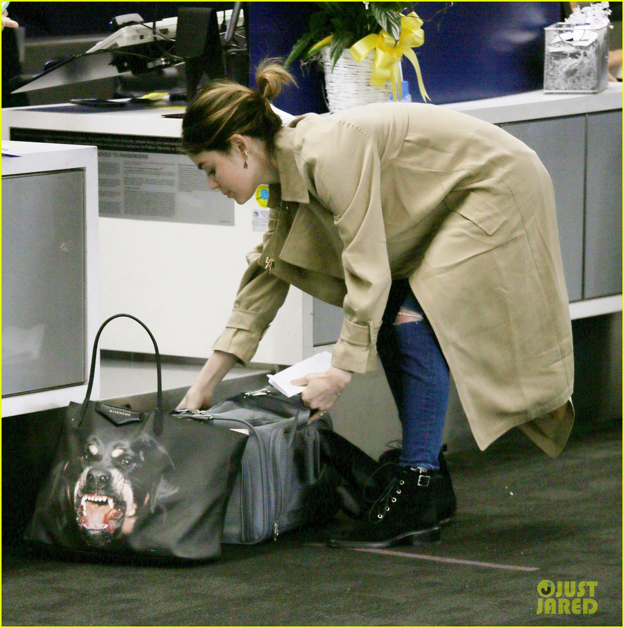 lucy hale carries rottweiler bag while traveling home for easter 03