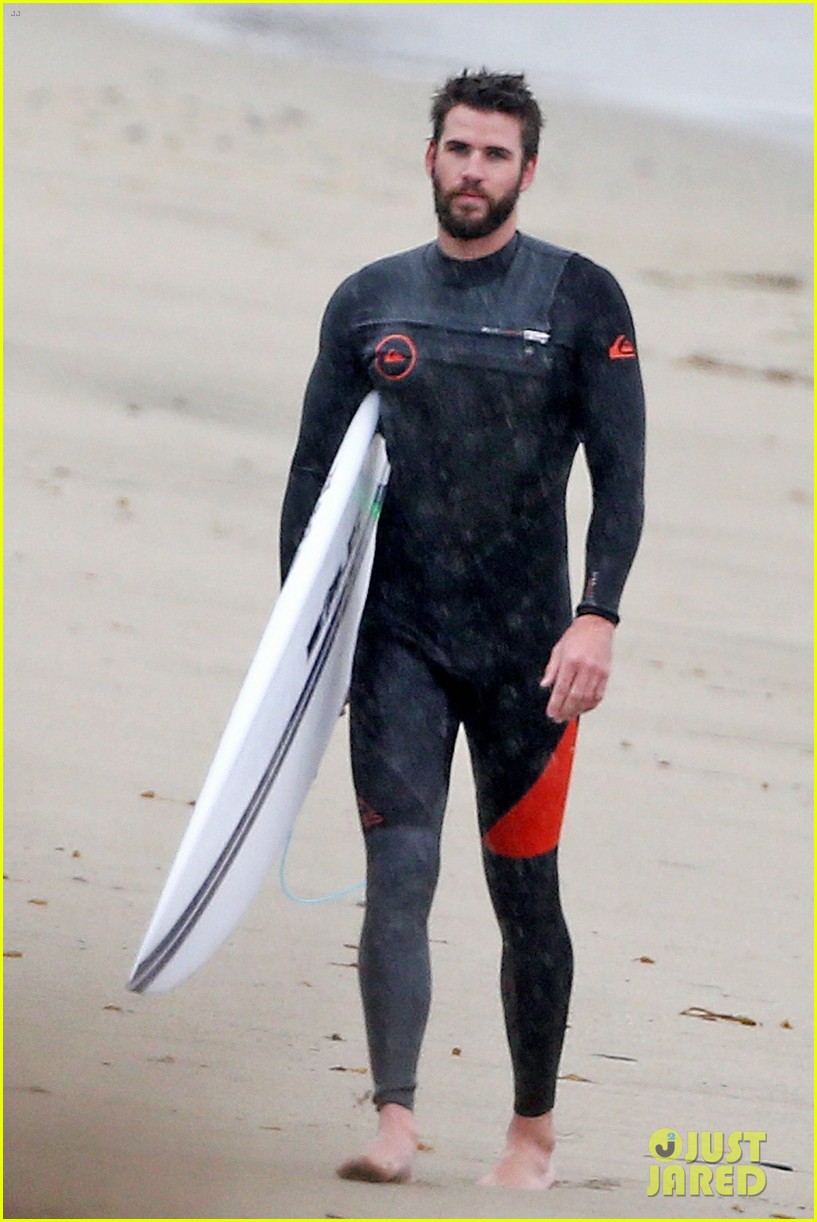 liam hemsworth and brother don their wetsuits while surfing in the rain 01
