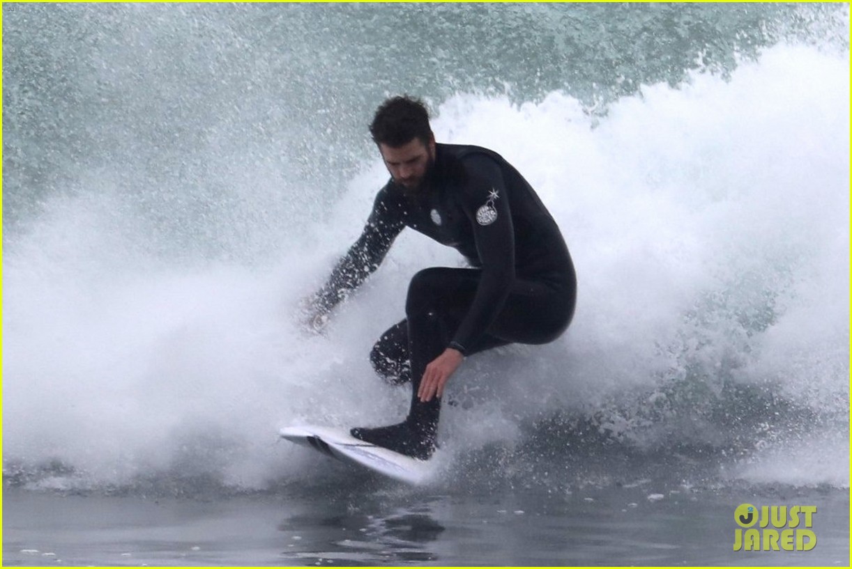 liam hemsworth puts surfing skills on display in malibu 18