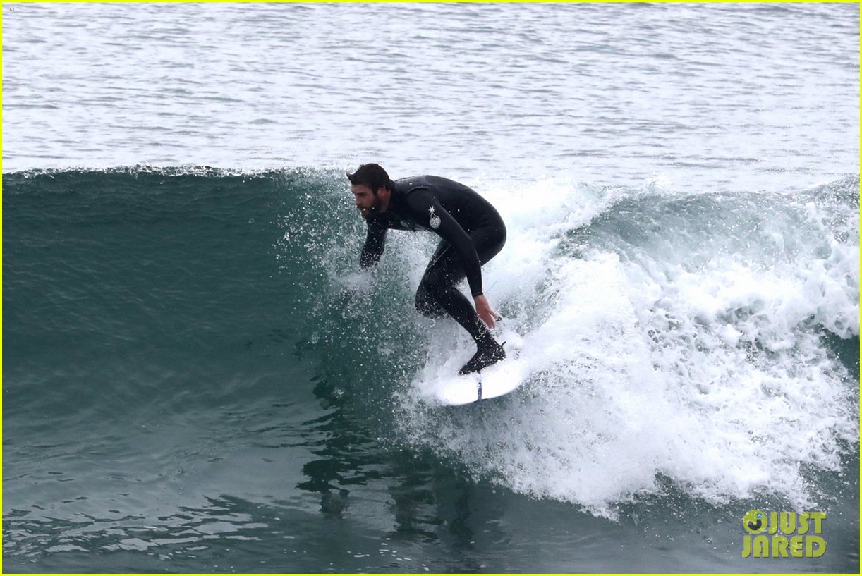 liam hemsworth puts surfing skills on display in malibu 19