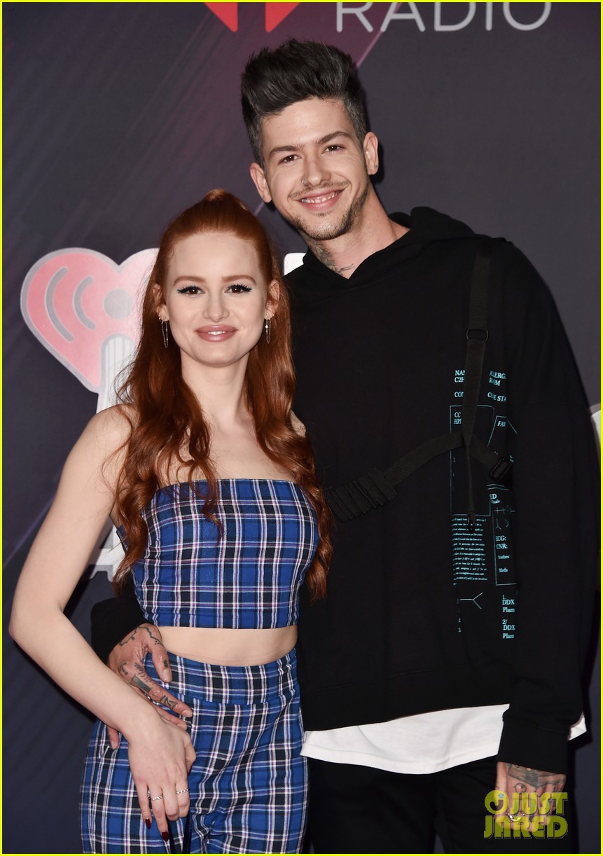 madelaine petsch gets a kiss from travis mills at iheart radio music awards 01