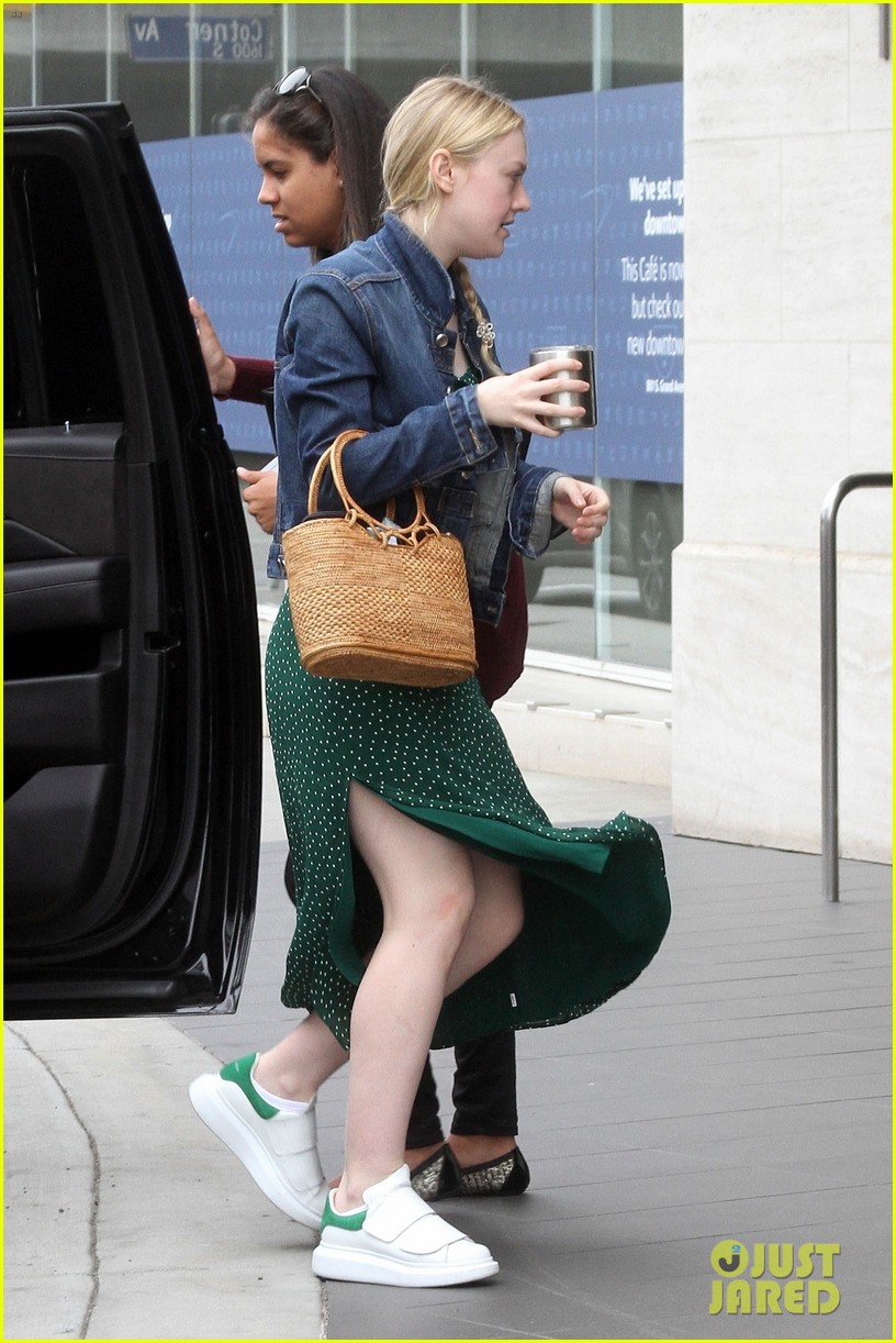 dakota fanning keeps it casual and trendy for la business meeting 01