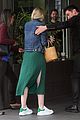 dakota fanning keeps it casual and trendy for la business meeting 05